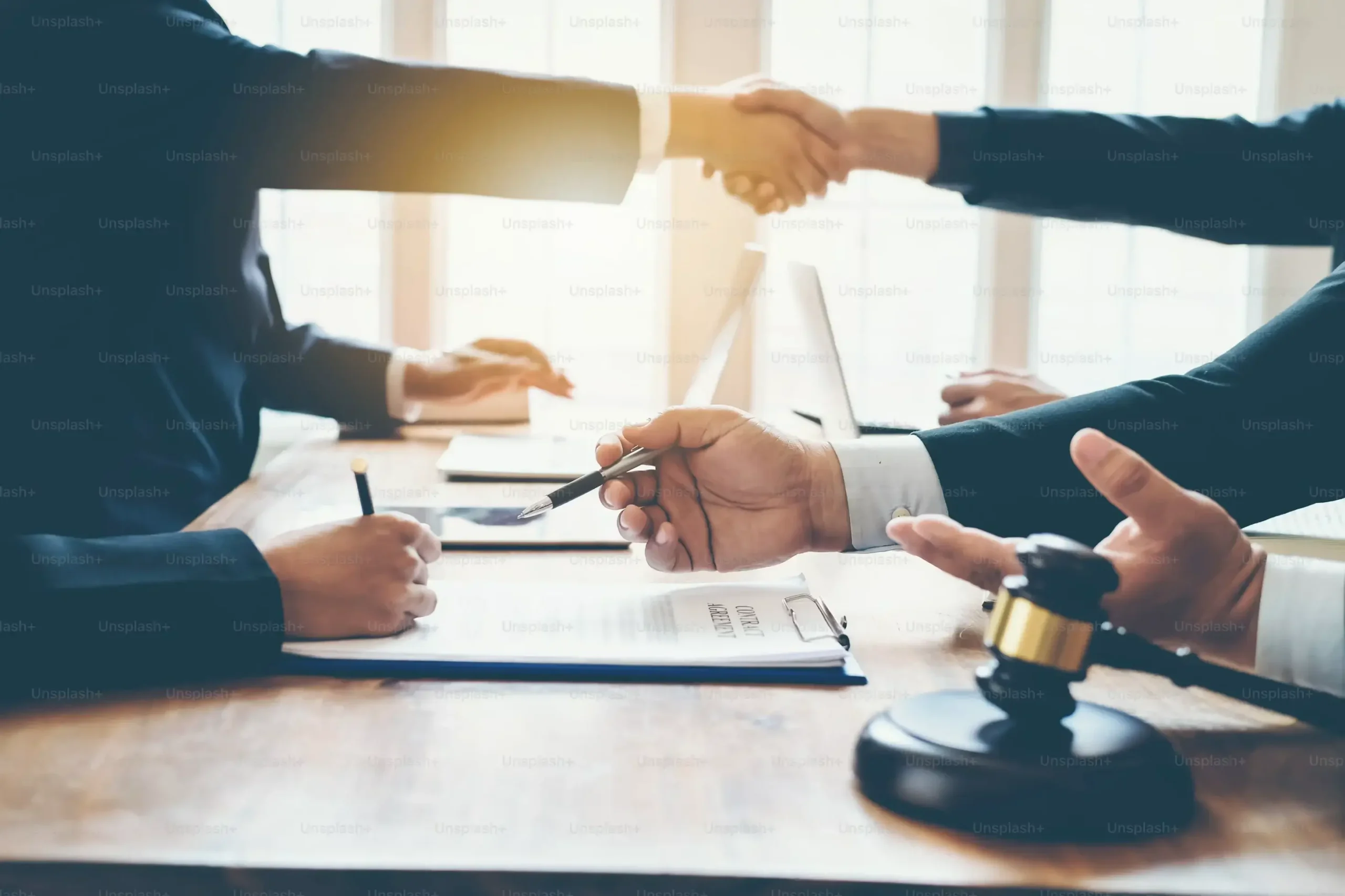 Business owner shaking hands with an SEO consultant after discussing SEO services and agreeing to work together.